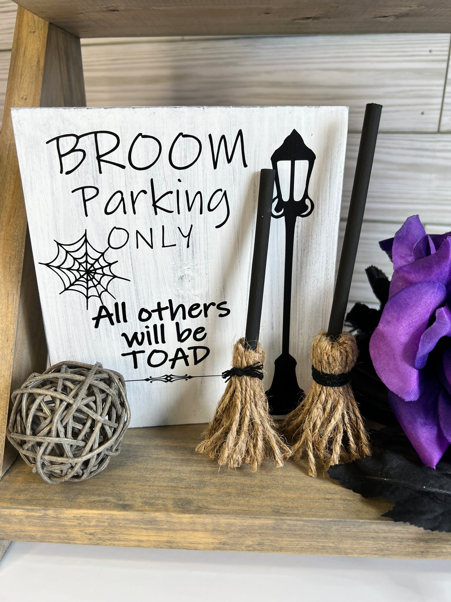 Broom Parking Only Sign