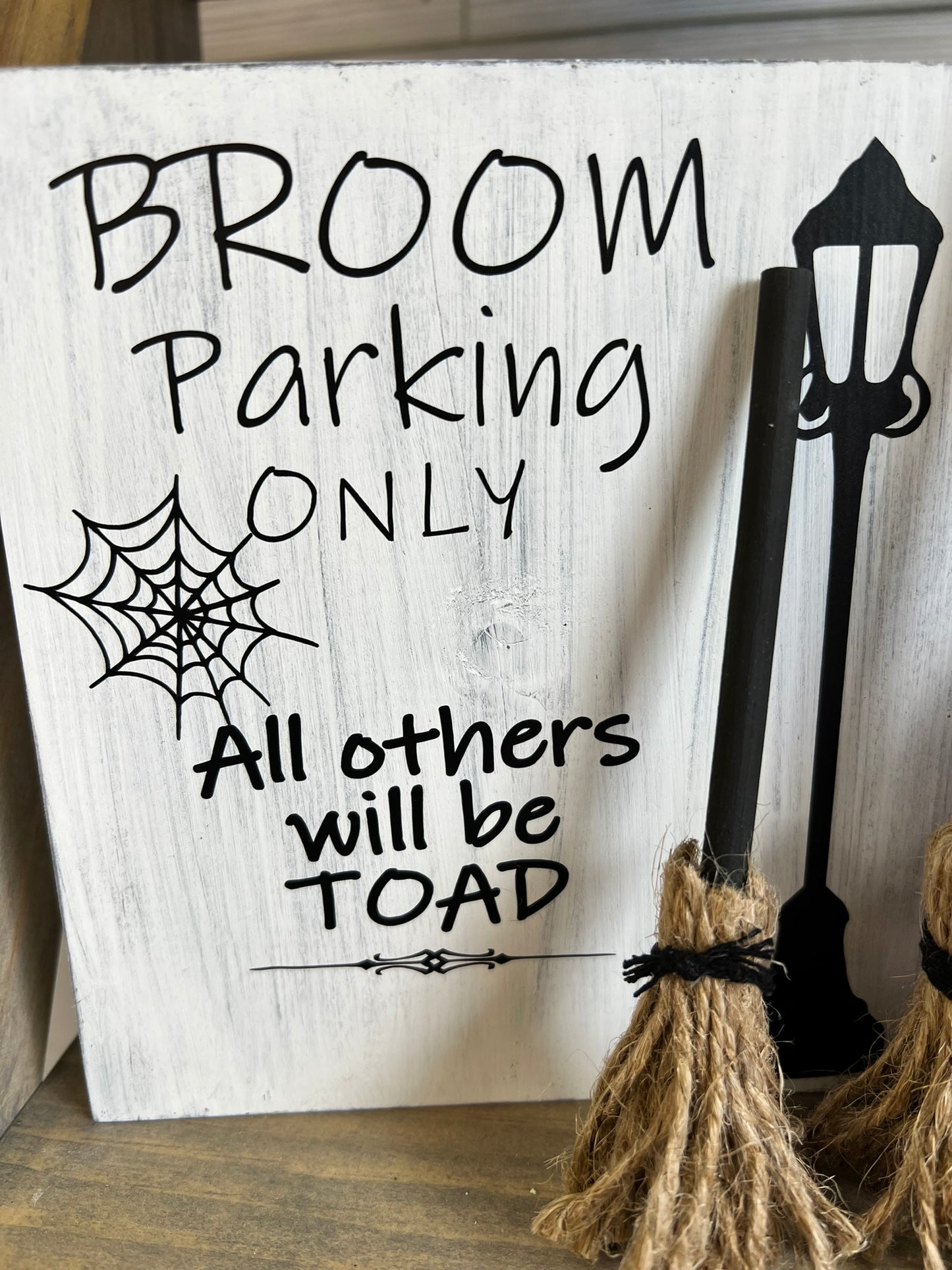 Broom Parking Only Sign