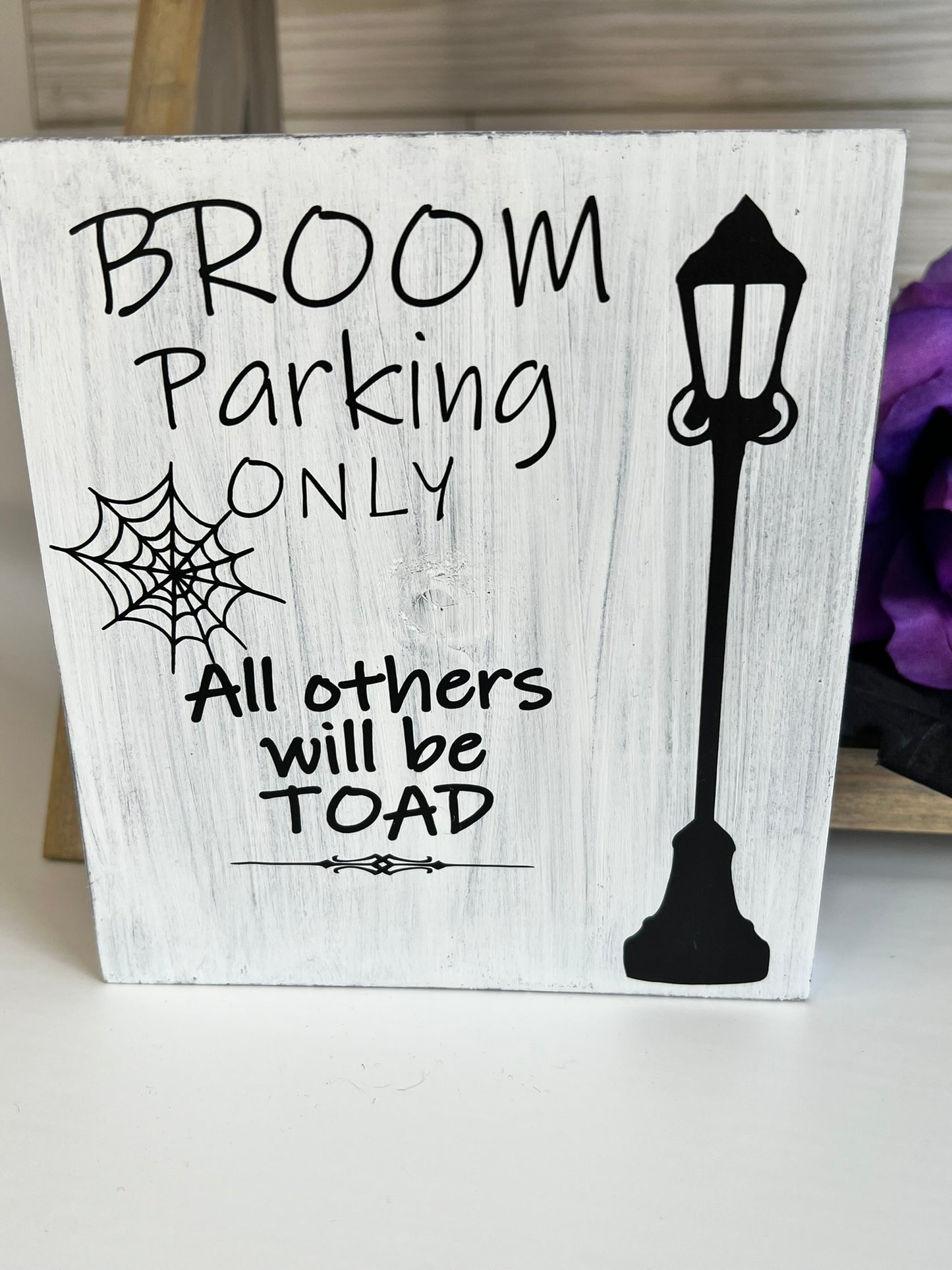 Broom Parking Only Sign
