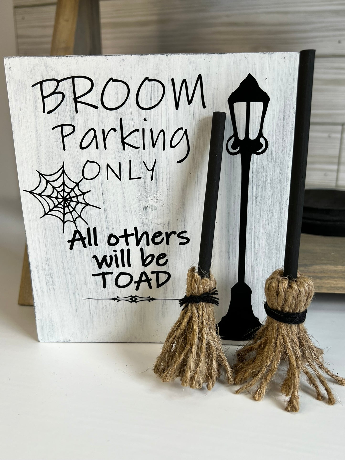 Broom Parking Only Sign