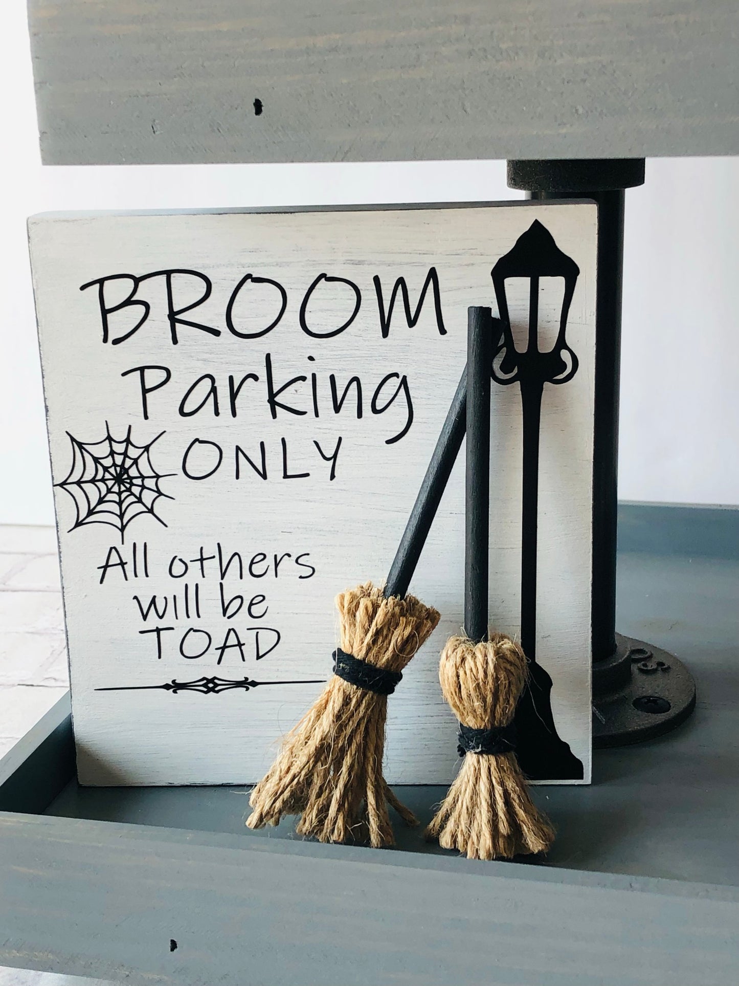 Broom Parking Only Sign